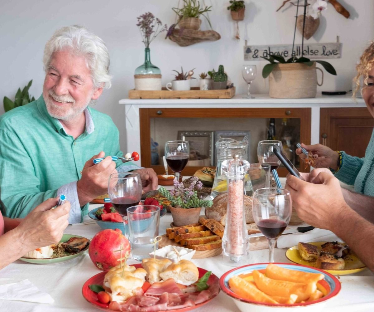 smiling-group-of-family-enjoying-food-and-drink-to-2024-11-02-23-12-44-utc_11zon